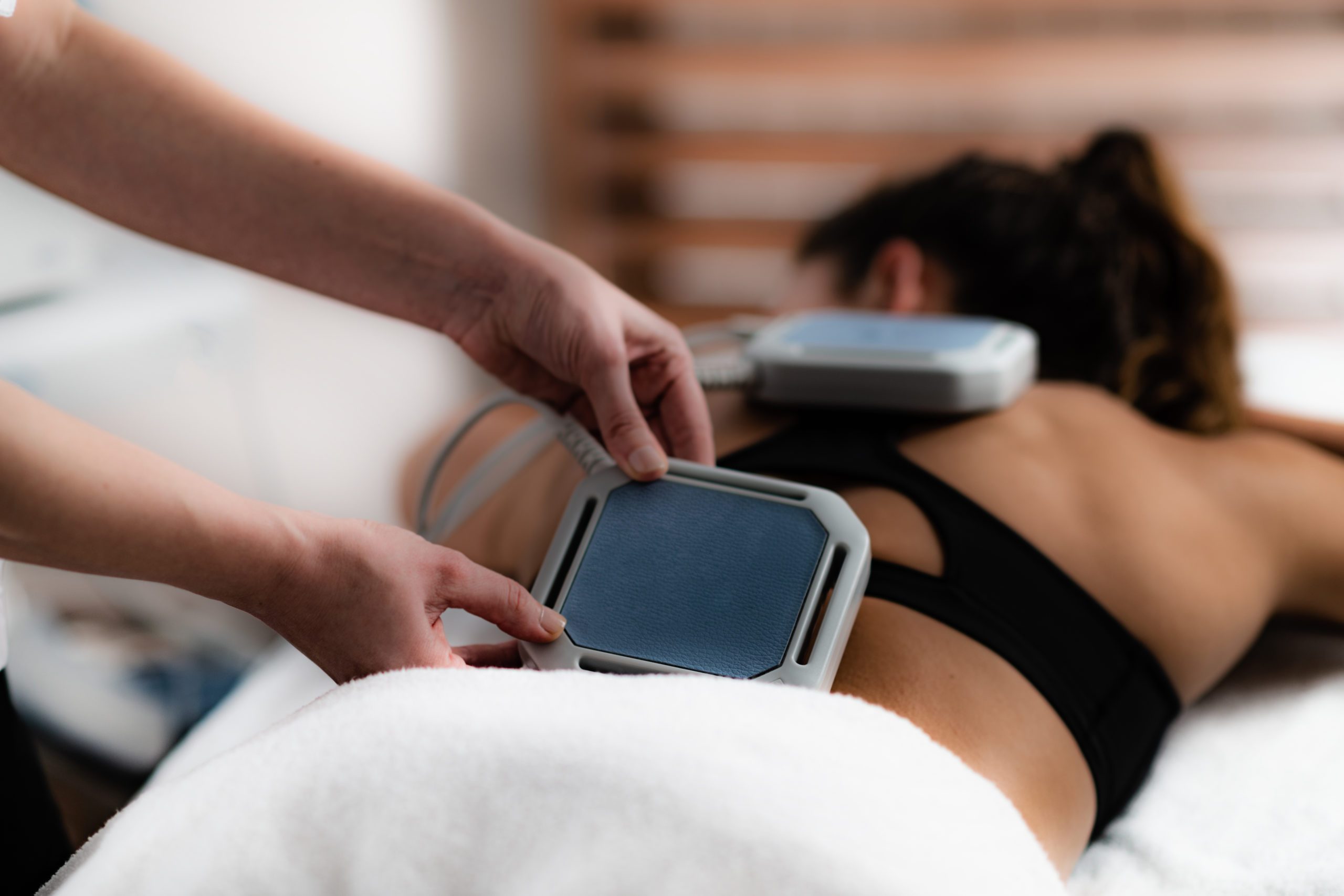 Magnet therapy. Magnets used in physical therapy, placed to patient's lower back.